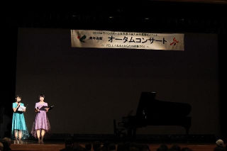 司会の九日さん